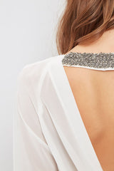 Blusa escotada en la espalda