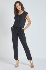 Mono fluido mujer jumpsuit sin mangas botones delanteros textura ligera elegante cómodo versátil suave color negro talla S perfecto oficina eventos casuales ✅Entrega 24/48h