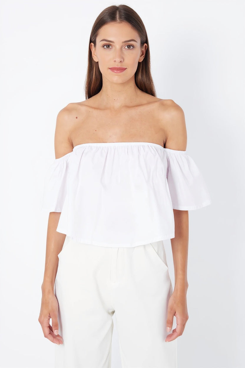 Blusa off shoulder mujer volante blanca, top hombros descubiertos algodón ligero, corte crop casual, aireada y elegante, ideal para verano, disponible talla L, look versátil fresco, combina jeans o falda. ✅Entrega 24/48h